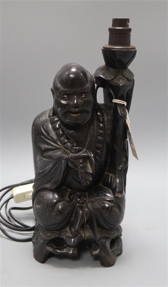 A lacquered Buddha converted to a lamp, early 20th century